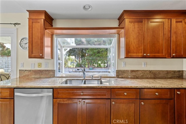 28610 Cloverleaf Pl, Castaic, CA 91384 - kitchen with dishwasher, light stone countertops, and brown cabinets