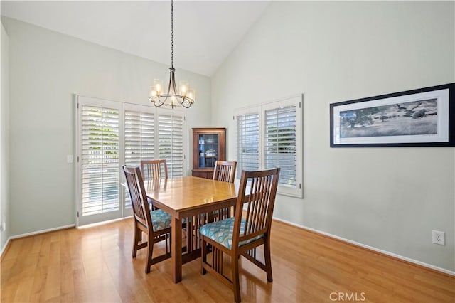 28610 Cloverleaf Pl, Castaic, CA 91384 - dining space featuring light wood finished floors, a chandelier, and high vaulted ceiling