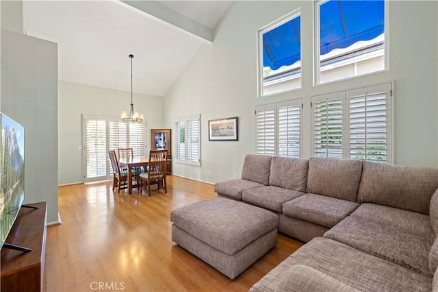 28610 Cloverleaf Pl, Castaic, CA 91384 - living area featuring high vaulted ceiling, a chandelier, light wood-style flooring, and beam ceiling