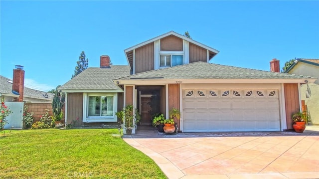 3210 S Center St, Santa Ana, CA 92704 - traditional-style house with concrete driveway, a front yard, a chimney, an attached garage, and roof with shingles