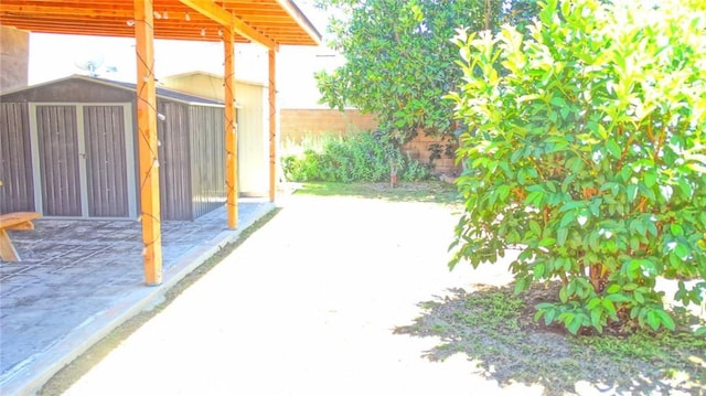 3210 S Center St, Santa Ana, CA 92704 - view of patio featuring a storage shed