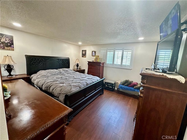 3210 S Center St, Santa Ana, CA 92704 - bedroom featuring a textured ceiling, dark wood-style flooring, and recessed lighting