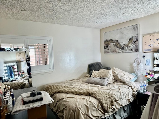 3210 S Center St, Santa Ana, CA 92704 - bedroom featuring a textured ceiling