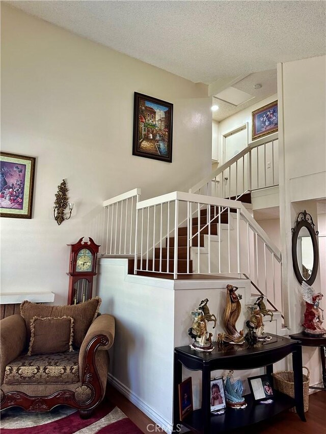 3210 S Center St, Santa Ana, CA 92704 - stairway featuring wood finished floors and a textured ceiling
