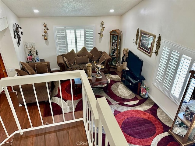 3210 S Center St, Santa Ana, CA 92704 - living room featuring a textured ceiling and recessed lighting