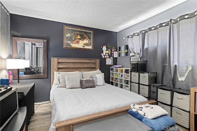5535 Ackerfield Ave Unit 47, Long Beach, CA 90805 - bedroom featuring wood finished floors and a textured ceiling