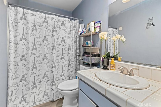 5535 Ackerfield Ave Unit 47, Long Beach, CA 90805 - bathroom featuring vanity, a shower with shower curtain, and wood finished floors