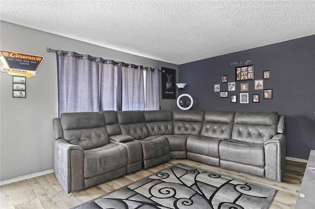 5535 Ackerfield Ave Unit 47, Long Beach, CA 90805 - living room featuring a textured ceiling and wood finished floors