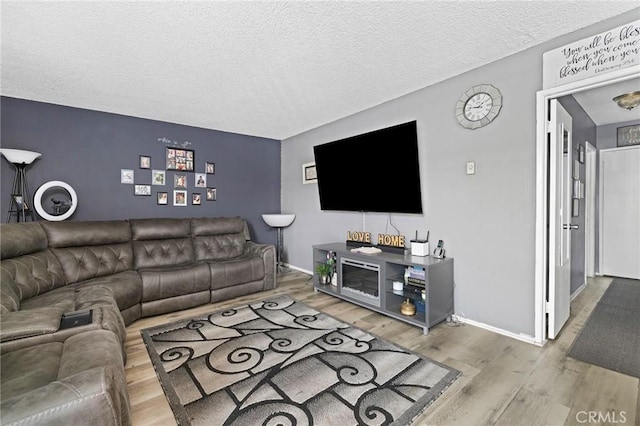 5535 Ackerfield Ave Unit 47, Long Beach, CA 90805 - living room with wood finished floors and a textured ceiling