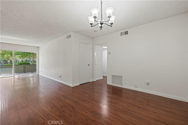 25735 Hogan Dr Unit E11, Valencia, CA 91355 - unfurnished room featuring a chandelier, wood finished floors, and a textured ceiling