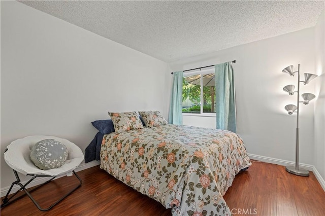 25735 Hogan Dr Unit E11, Valencia, CA 91355 - bedroom featuring wood finished floors and a textured ceiling