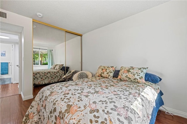 25735 Hogan Dr Unit E11, Valencia, CA 91355 - bedroom with wood finished floors and a closet