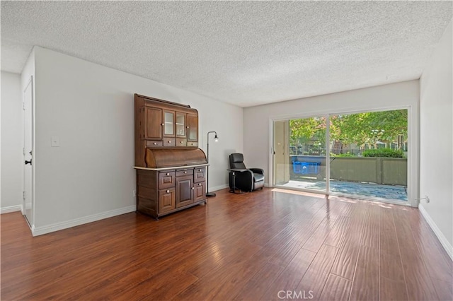 25735 Hogan Dr Unit E11, Valencia, CA 91355 - living room featuring dark wood finished floors and a textured ceiling