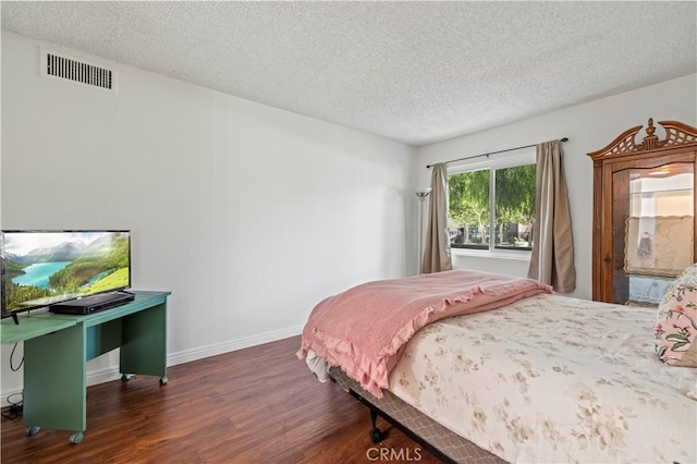 25735 Hogan Dr Unit E11, Valencia, CA 91355 - bedroom featuring wood finished floors and a textured ceiling