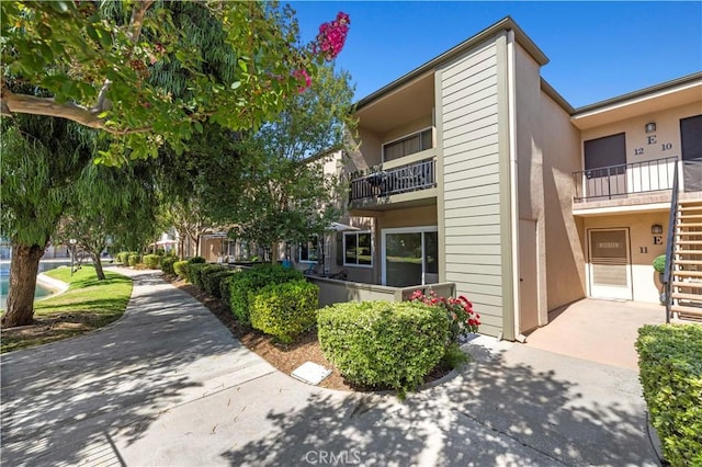 25735 Hogan Dr Unit E11, Valencia, CA 91355 - view of building exterior featuring stairway