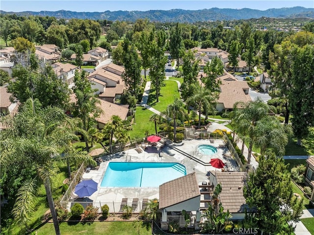 25735 Hogan Dr Unit E11, Valencia, CA 91355 - aerial perspective of suburban area featuring a pool area and a mountainous background