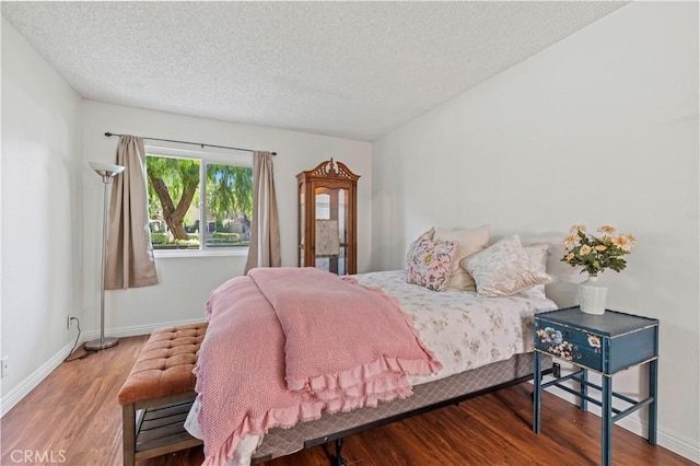 25735 Hogan Dr Unit E11, Valencia, CA 91355 - bedroom featuring a textured ceiling and wood finished floors