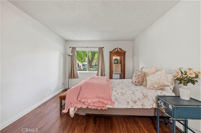 25735 Hogan Dr Unit E11, Valencia, CA 91355 - bedroom featuring wood finished floors and a textured ceiling