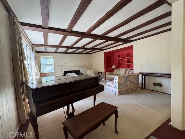 736 Burleigh Dr, Pasadena, CA 91105 - sitting room with a fireplace, beamed ceiling, and carpet