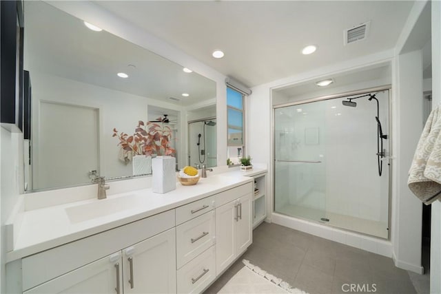 185 Magnet, Irvine, CA 92618 - full bath featuring double vanity, a stall shower, recessed lighting, and tile patterned floors