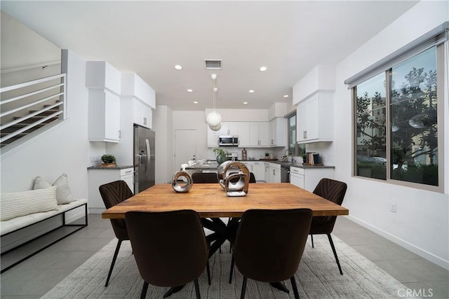 185 Magnet, Irvine, CA 92618 - dining area with light tile patterned floors and recessed lighting