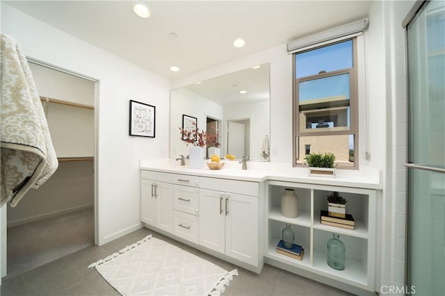 185 Magnet, Irvine, CA 92618 - bathroom with double vanity, a spacious closet, recessed lighting, a shower with shower door, and tile patterned floors