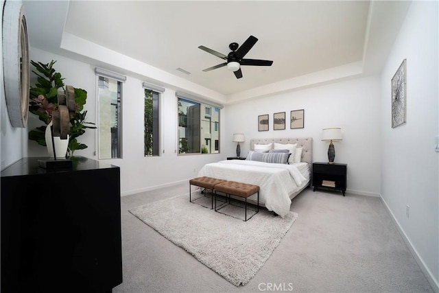 185 Magnet, Irvine, CA 92618 - carpeted bedroom with a tray ceiling and a ceiling fan