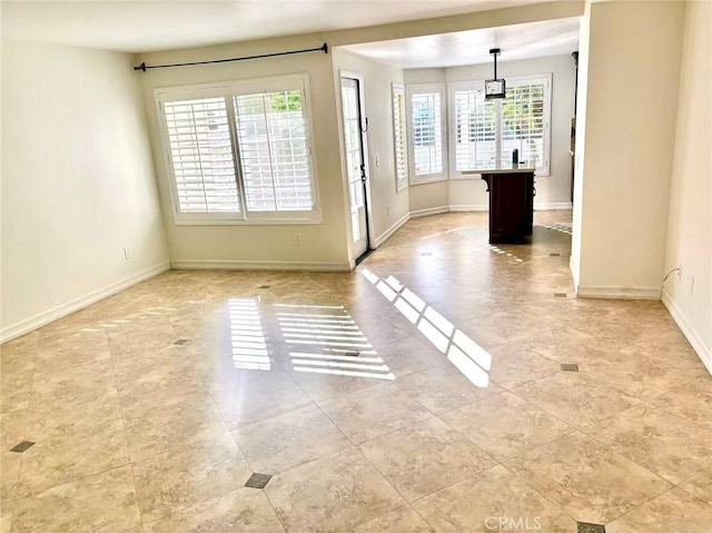 72 Coral Unit 38, Irvine, CA 92614 - unfurnished dining area with healthy amount of natural light and light tile patterned floors