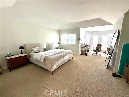 72 Coral Unit 38, Irvine, CA 92614 - bedroom featuring light colored carpet, french doors, and lofted ceiling