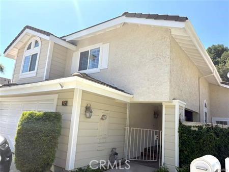 72 Coral Unit 38, Irvine, CA 92614 - traditional-style house with a garage and stucco siding