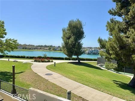 72 Coral Unit 38, Irvine, CA 92614 - view of home's community with a water view and a lawn