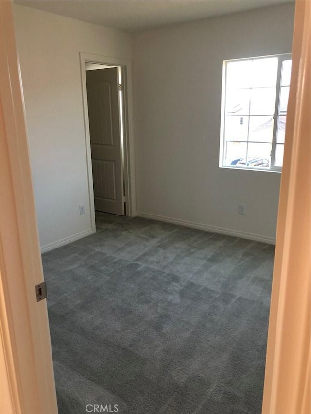 1031 Coriander St, Calimesa, CA 92320 - unfurnished room featuring dark colored carpet