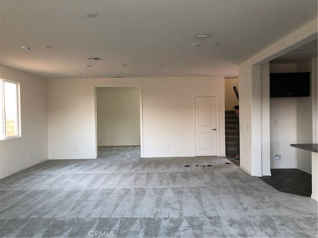 1031 Coriander St, Calimesa, CA 92320 - unfurnished room featuring stairway and carpet