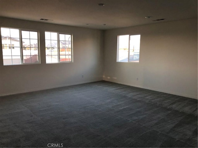 1031 Coriander St, Calimesa, CA 92320 - spare room featuring dark carpet and baseboards