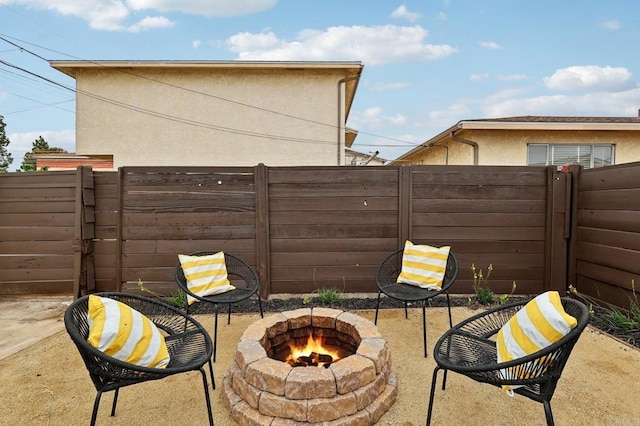 3821 Shiloh Rd, San Diego, CA 92105 - fenced backyard with an outdoor fire pit, a gate, and a patio area