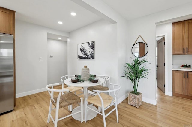 3821 Shiloh Rd, San Diego, CA 92105 - dining area with light wood finished floors and recessed lighting