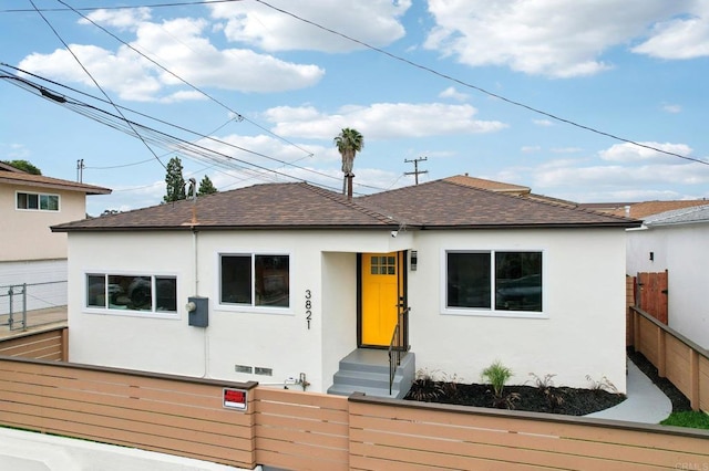 3821 Shiloh Rd, San Diego, CA 92105 - bungalow-style home with a fenced front yard, stucco siding, and roof with shingles
