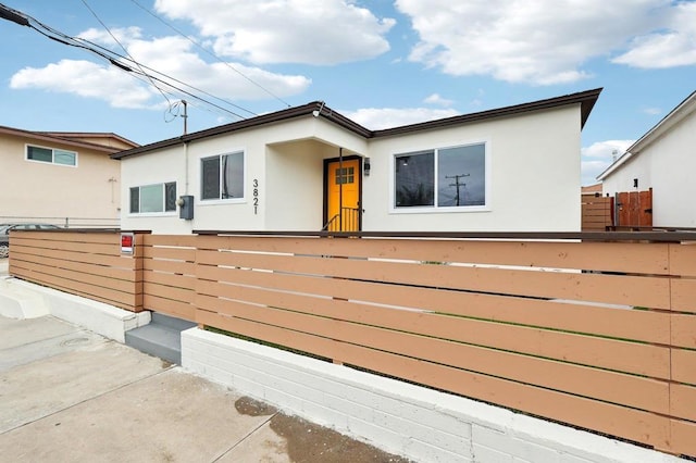 3821 Shiloh Rd, San Diego, CA 92105 - view of front of home with stucco siding and a fenced front yard