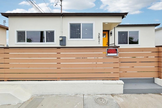 3821 Shiloh Rd, San Diego, CA 92105 - view of front of property with stucco siding and a fenced front yard