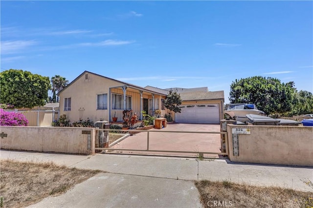 526 Cluster Ln, Redondo Beach, CA 90278 - view of front of property with a garage, a fenced front yard, concrete driveway, and stucco siding