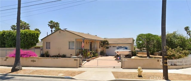 526 Cluster Ln, Redondo Beach, CA 90278 - view of front of home with a fenced front yard, a garage, and stucco siding