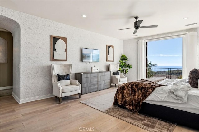3 Coral Cay, Newport Coast, CA 92657 - bedroom featuring light wood-style flooring, arched walkways, recessed lighting, ceiling fan, and access to exterior