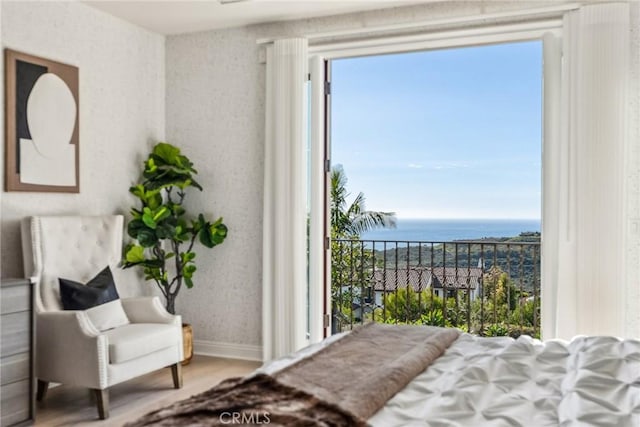 3 Coral Cay, Newport Coast, CA 92657 - bedroom with a water view, wood finished floors, and multiple windows