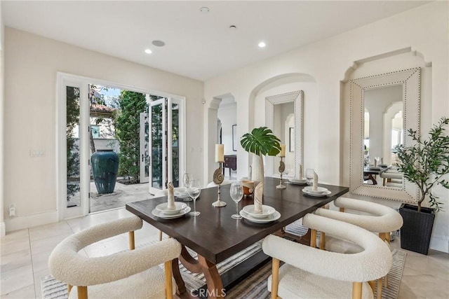 3 Coral Cay, Newport Coast, CA 92657 - dining room featuring arched walkways, light tile patterned floors, and recessed lighting