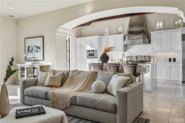 3 Coral Cay, Newport Coast, CA 92657 - living room featuring arched walkways and recessed lighting