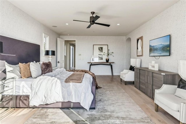 3 Coral Cay, Newport Coast, CA 92657 - bedroom featuring light wood-style flooring, recessed lighting, a ceiling fan, and arched walkways
