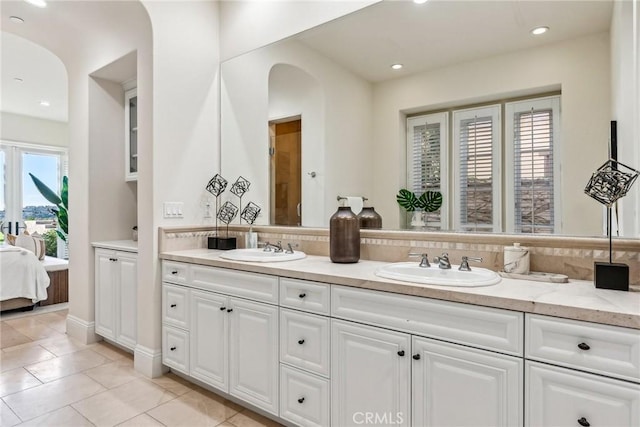 3 Coral Cay, Newport Coast, CA 92657 - ensuite bathroom with double vanity, tile patterned floors, tasteful backsplash, and recessed lighting