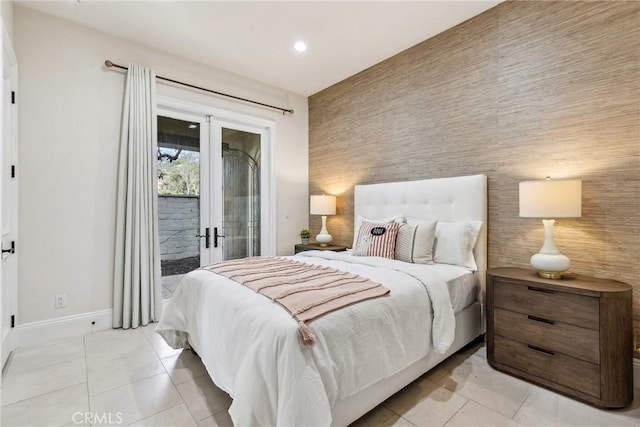 3 Coral Cay, Newport Coast, CA 92657 - bedroom featuring an accent wall, access to outside, french doors, light tile patterned floors, and recessed lighting