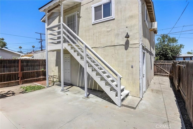 124 N Princeton Ave, Fullerton, CA 92831 - back of property featuring stairs, a patio, and a fenced backyard