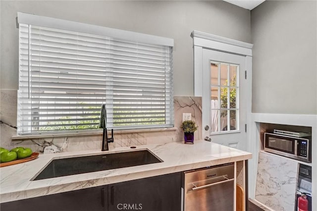 1616 E Ocean Blvd Unit 6, Long Beach, CA 90802 - kitchen with appliances with stainless steel finishes, plenty of natural light, tasteful backsplash, and light stone countertops